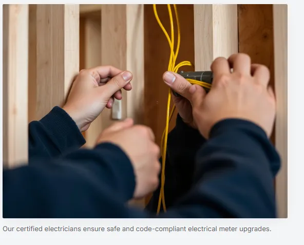 Electrician routing service wiring between wall studs during a meter upgrade