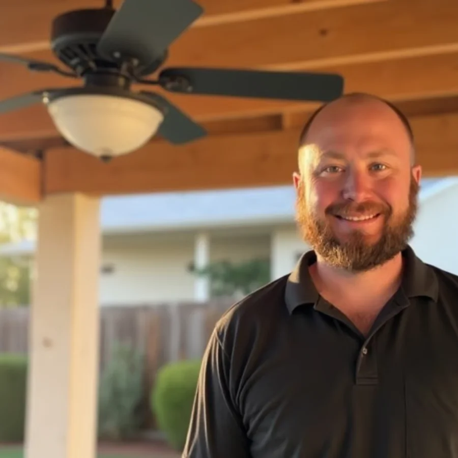 O’Bray Electric team member standing on a covered porch