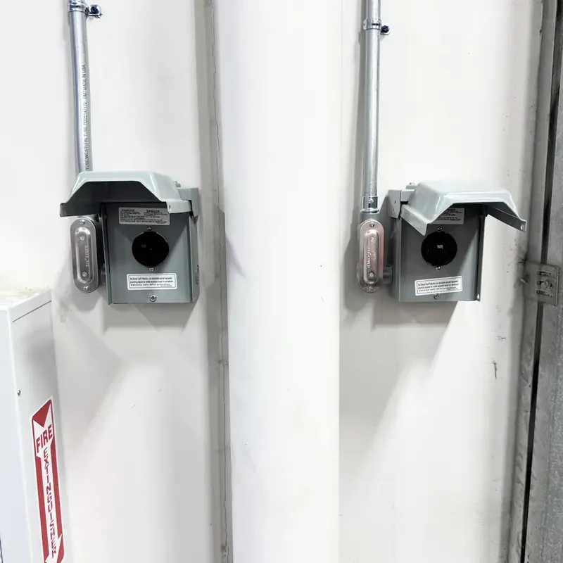 Electrician installing a new circuit and breaker for a basement remodel